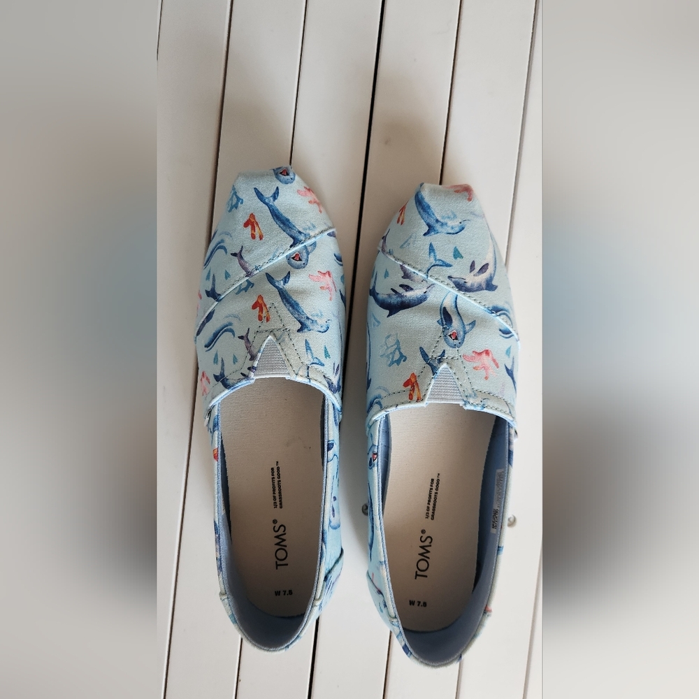 Toms Dolphins print slip on Alpargata shoes. Size:7.5W color: baby blue.